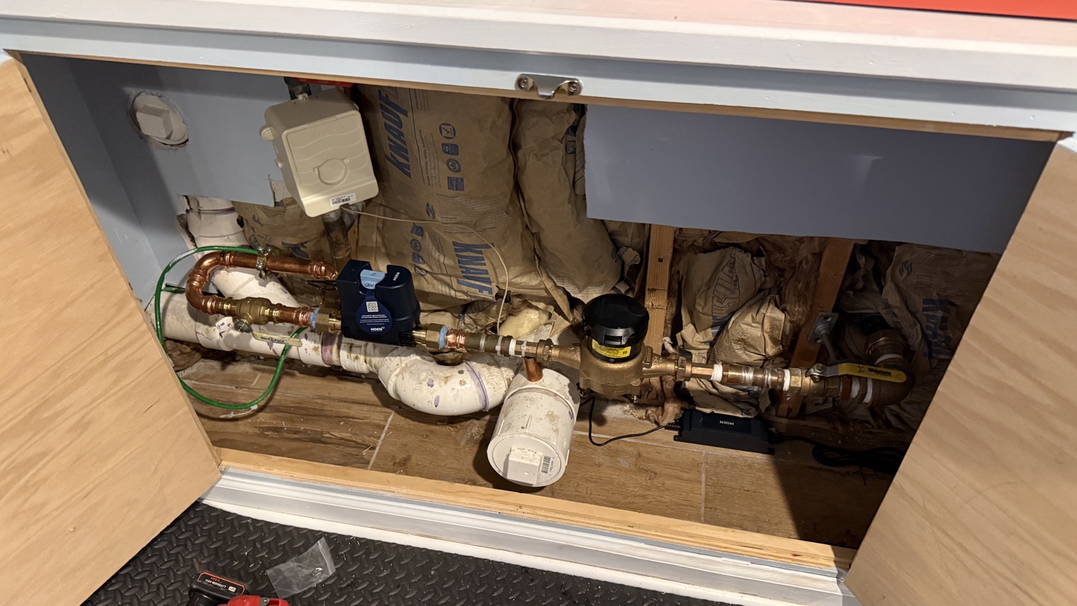 Water-service piping with a Moen control device at a Rutherford job.